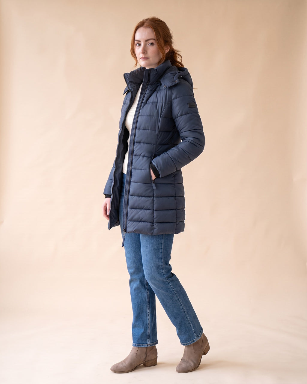 Long Quilted Puffer in Navy Blue, styled full-length view on model