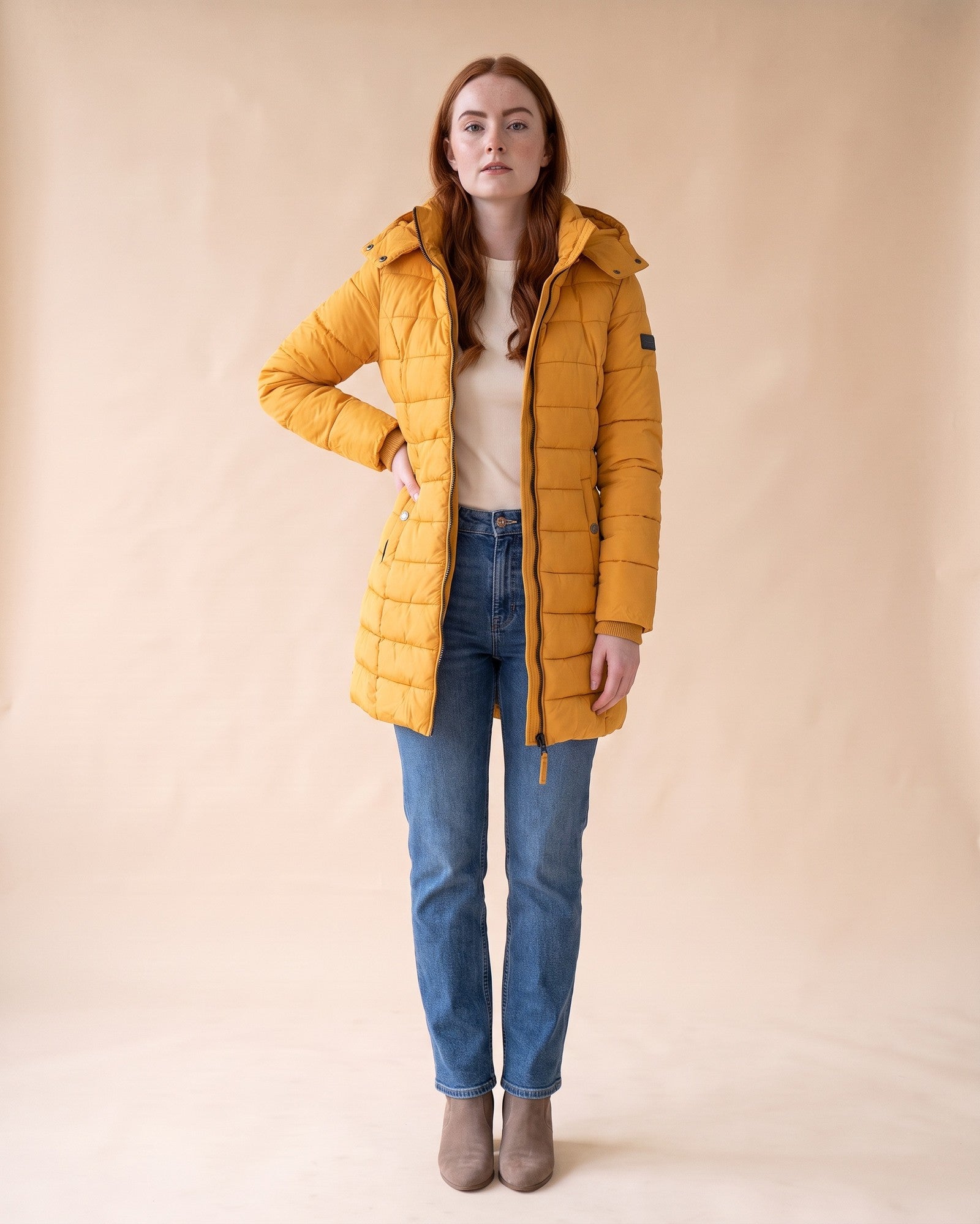 Long Quilted Puffer in Yellow, full-length front view on model